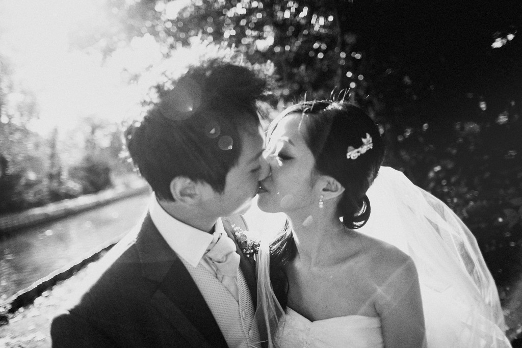 nicholas-lau-nicholau-weddings-london-film-photography-beautiful-pretty-blog-first-wedding-love-cute-white-dress-chinese-asian-black-and-white-bride-newlywed-groom-kiss-sun