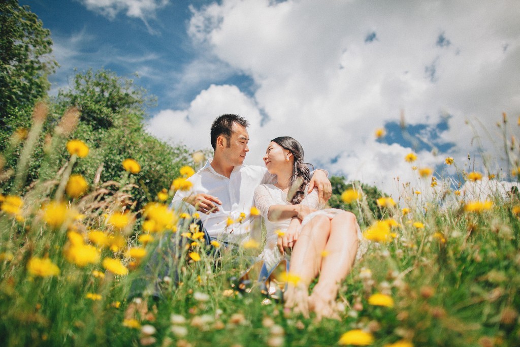 nicholas-lau-nicholau-weddings-london-film-photography-beautiful-pretty-blog-love-cute-white-dress-chinese-asian-engagement-ring-diamond-looking-into-eyes-blue-sky-meadow-wild-grass-flowers