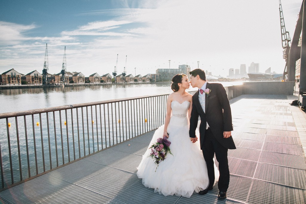 nicholas-lau-nicholau-weddings-london-world-global-film-photography-beautiful-pretty-blog-first-wedding-love-cute-white-dress-chinese-asian-couple-groom=bride-kissing-bouquet-bridge-thames