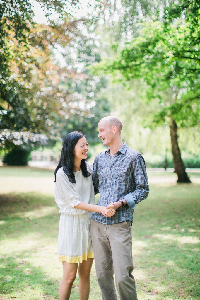 nicholas-lau-nicholau-weddings-london-film-photography-beautiful-pretty-engagement-love-interracial-asian-white-smiling-happy-holding-each-other-in-the-park