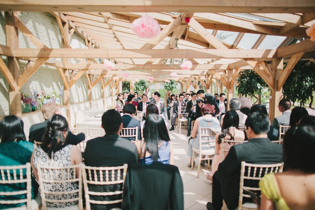 nicholas-lau-nicholau-london-film-fine-art-photography-beautiful-blog-first-wedding-love-cute-white-dress-chinese-asian-Gaynes-park-sun-through-rafters-on-ceremony-family-and-friends
