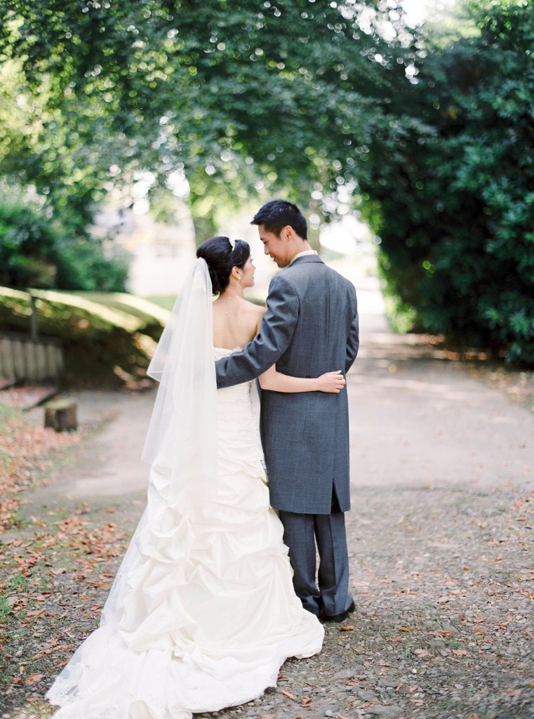 nicholas-lau-nicholau-london-film-photography-chinese-asian-grey-suit-long-tail-wedding-bride-groom-path-garden