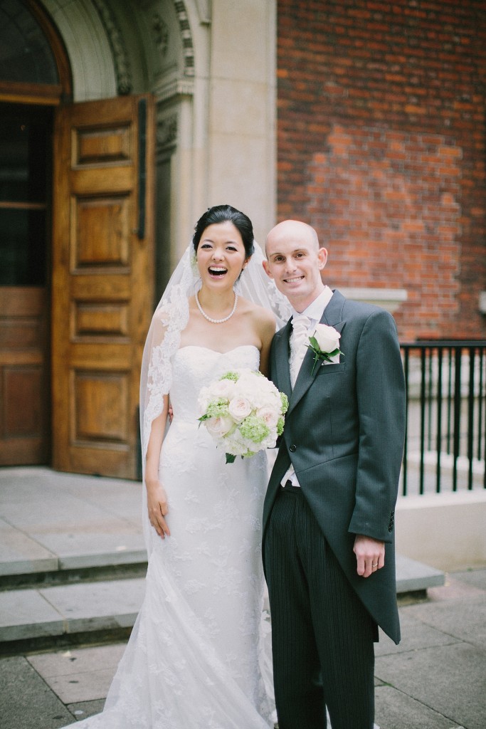 nicholau-nicholas-lau-interracial-wedding-bride-groom-dressed-up-in-front-of-church-happy-white-korean
