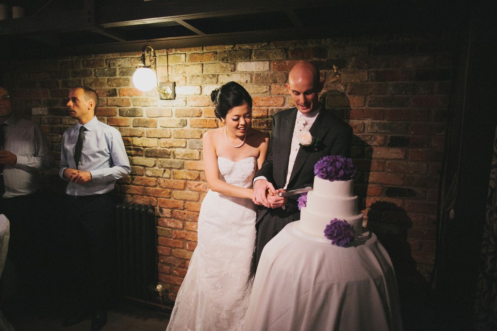 nicholau-nicholas-lau-interracial-wedding-cut-the-cake-three-tier-purple-and-white-cake