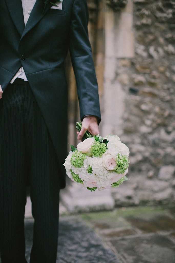 nicholau-nicholas-lau-interracial-wedding-groom-black-suit-holding-the-bouquet