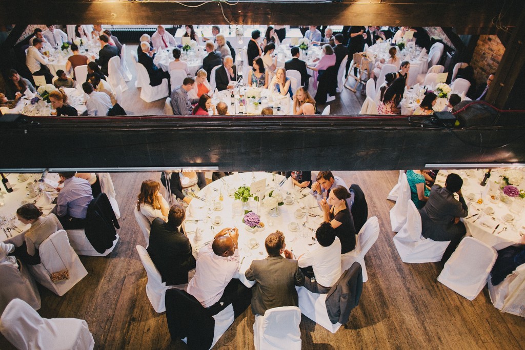 nicholau-nicholas-lau-interracial-wedding-overview-guests-tables-reception-beam