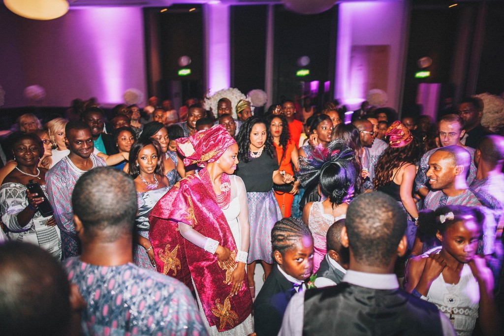 Nicholau-nicholas-lau-photography-london-uk-wedding-fine-art-film-nigerian-black-african-traditional-kele-robe-bride-dancing-magenta-party-reception