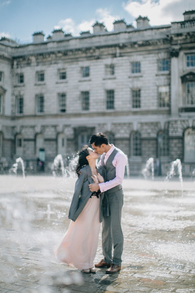 nicholas-lau-nicholau-chinese-london-uk-film-fine-art-photography-engagement-couple-pre-wedding-grey-suit-cute-romance-somerset-house-fountains-jacket-around-my-shoulders