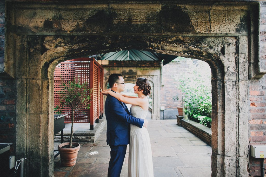nicholau-nicholas-lau-wedding-fine-art-photography-london-chinese-asian-hands-on-shoulders-bride-groom-hug-embrance-kensington-arch-gardens-path