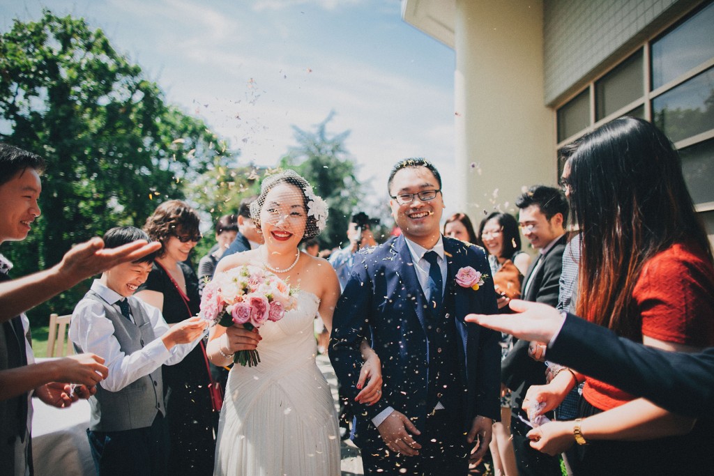 nicholau-nicholas-lau-wedding-fine-art-photography-london-chinese-asian-just-married-bride-groom-happy-smiling-throw-rice-bouquet-blue-suit
