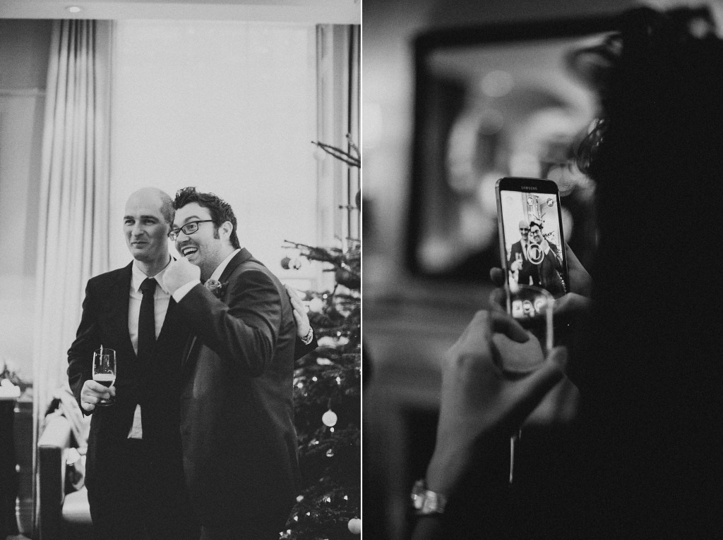 nicholas-lau-nicholau-wedding-photography-photographer-fine-art-film-winter-christmas-london-UK-modern-unique-the-arch-asia-house-cell-phone-photo-groom-ceremony-black-white