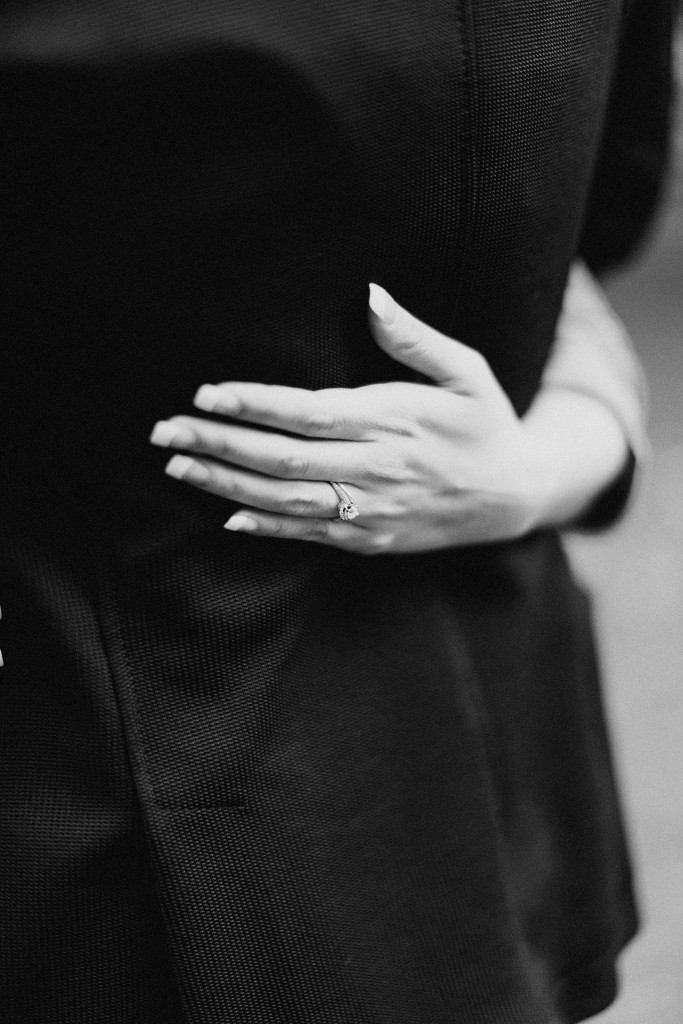 nicholau-nicholas-lau-couple-pre-wedding-film-fine-art-photography-red-blazer-leaves-fall-autumn-kew-gardens-uk-london-engagement-ring-hand-back-blazer-black-white-diamond