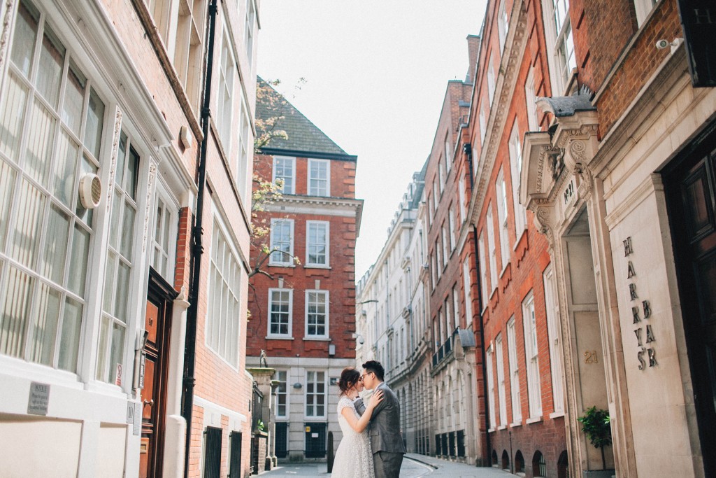 nicholas-lau-nicholau-photo-photography-fine-art-hybrid-engagement-chinese-asian-couple-london-uk-white-dress-grey-suit-holding-each-other-in-streets