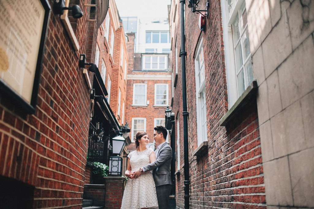 nicholas-lau-nicholau-photo-photography-fine-art-hybrid-engagement-chinese-asian-couple-london-uk-white-dress-grey-suit-red-brickes-holding-her-back