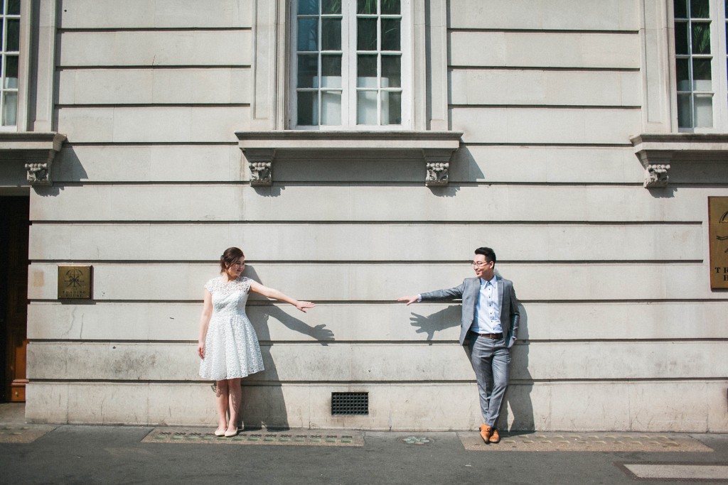 nicholas-lau-nicholau-photo-photography-fine-art-hybrid-engagement-chinese-asian-couple-london-uk-white-dress-grey-suit-urban-couple-reaching