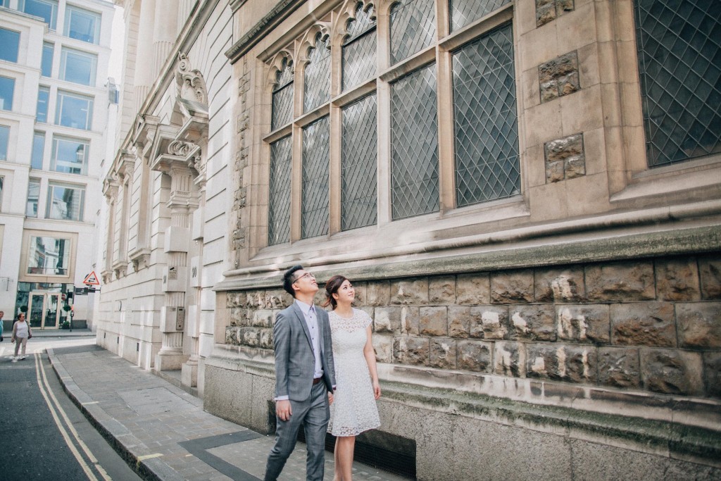 nicholas-lau-nicholau-photo-photography-fine-art-hybrid-engagement-chinese-asian-couple-london-uk-white-dress-grey-suit-walking-through-buiildings-admiring