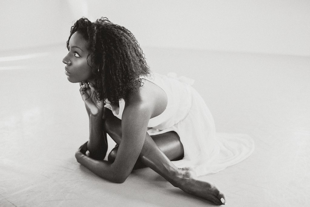 nicholas-lau-photo-photography-uk-london-black-african-american-ballerina-ballet-flats-dancer-dancing-light-sun-sudio-barefoot-black-white-crossed-legs-stretching