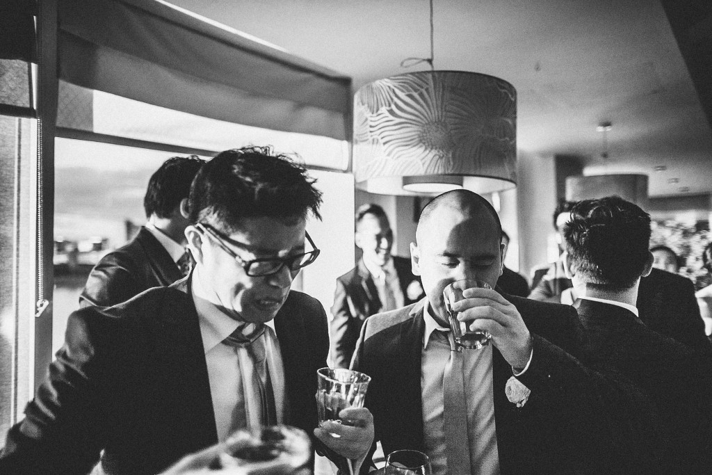 nicholas-lau-photo-photography-wedding-uk-london-asian-chinese-groomsmen-drinking-black-white-reception