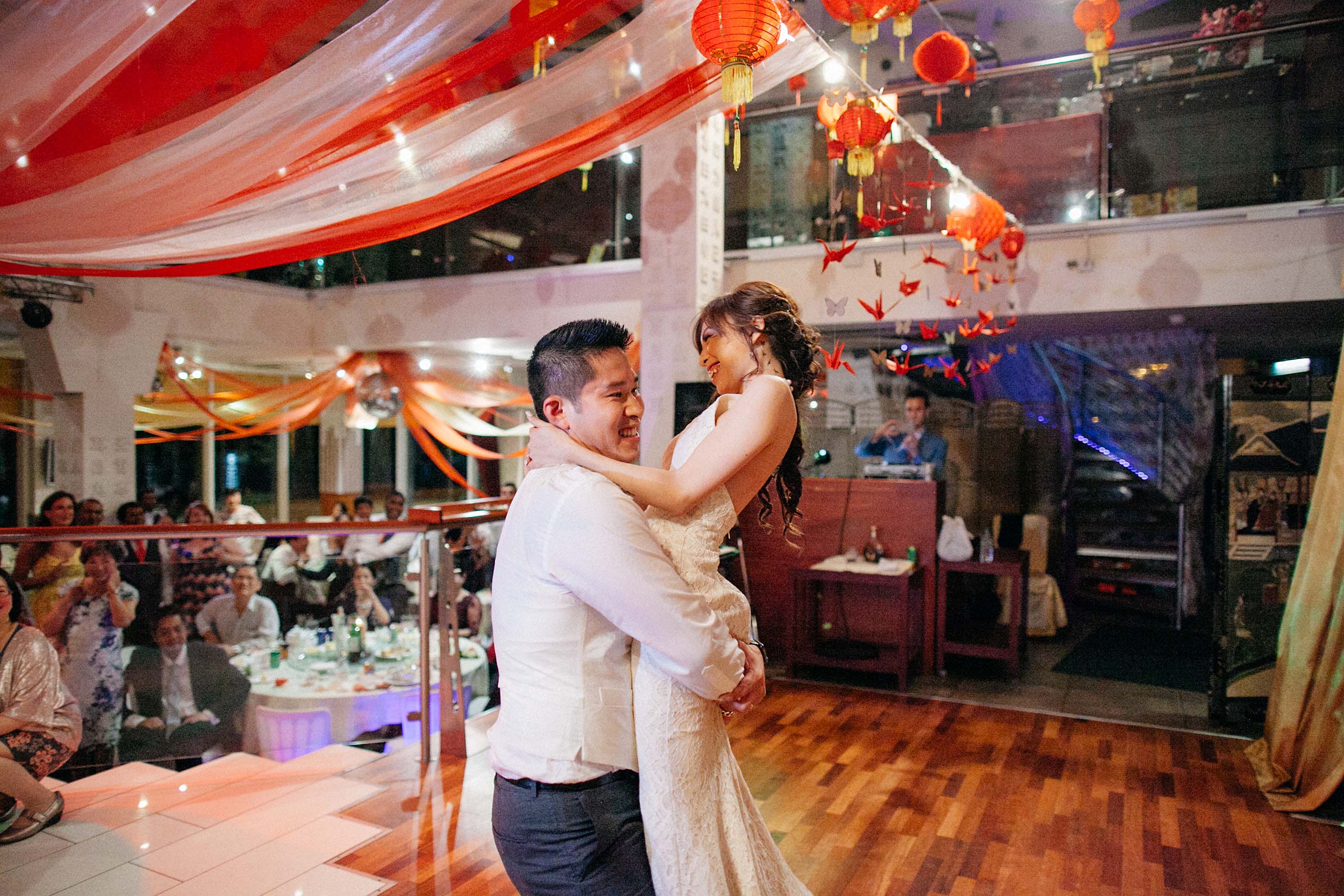 nicholas-lau-photo-photography-fine-art-film-wedding-london-asian-chinese-uk-mulitcultural-ceremony-reception-groom-picking-up-bride-during-dance-china-boulevard