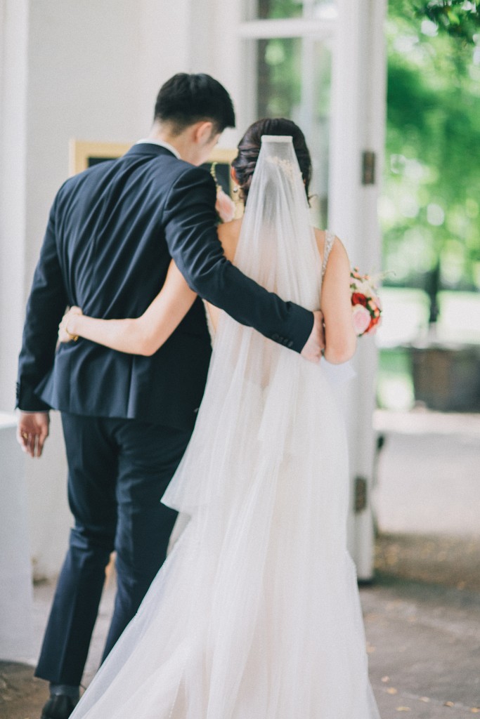 nicholas-lau-photo-photography-wedding-uk-london-holland-park-gardens-orangery-the-chinese-couple-summer-beautiful-photographer-arms-around-each-other-leaving-the-ceremony-love